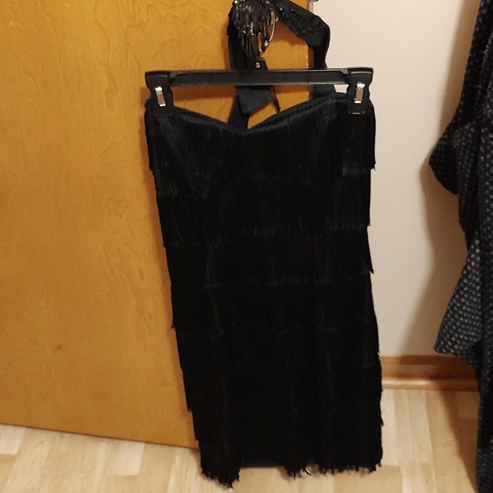 Fringe swaying dress with neck piece attached goes around the neck.